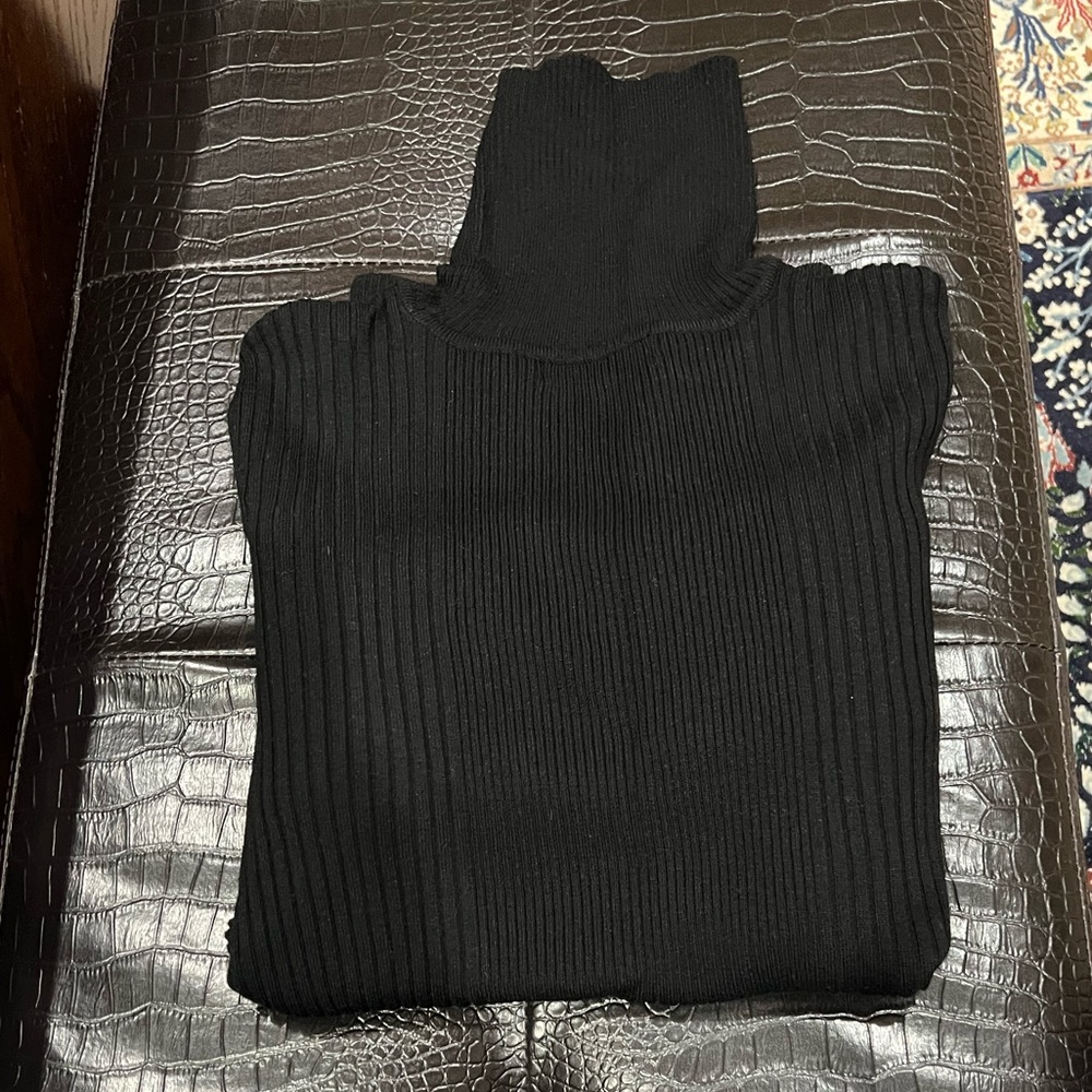 Style and Co ribbed turtleneck sweater with button on sleeve details.